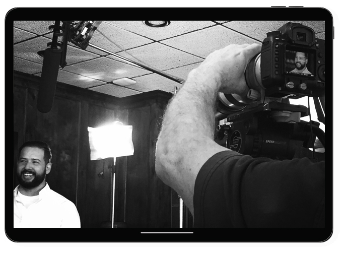 Michael Dillon at Photoshoot behind the scenes and laughing